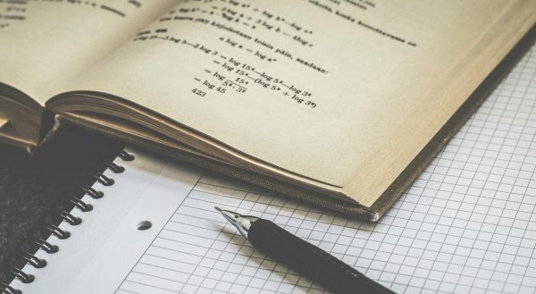 black click pen on white paper