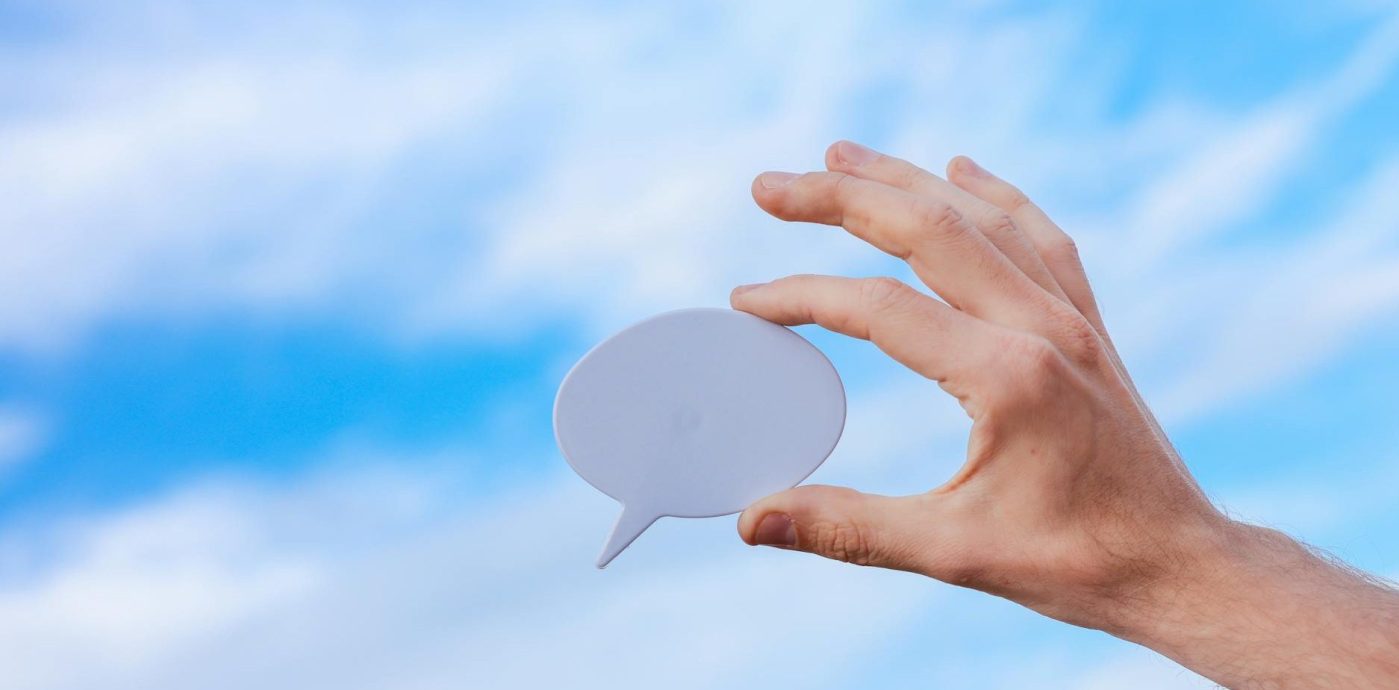 a person holding a thought bubble